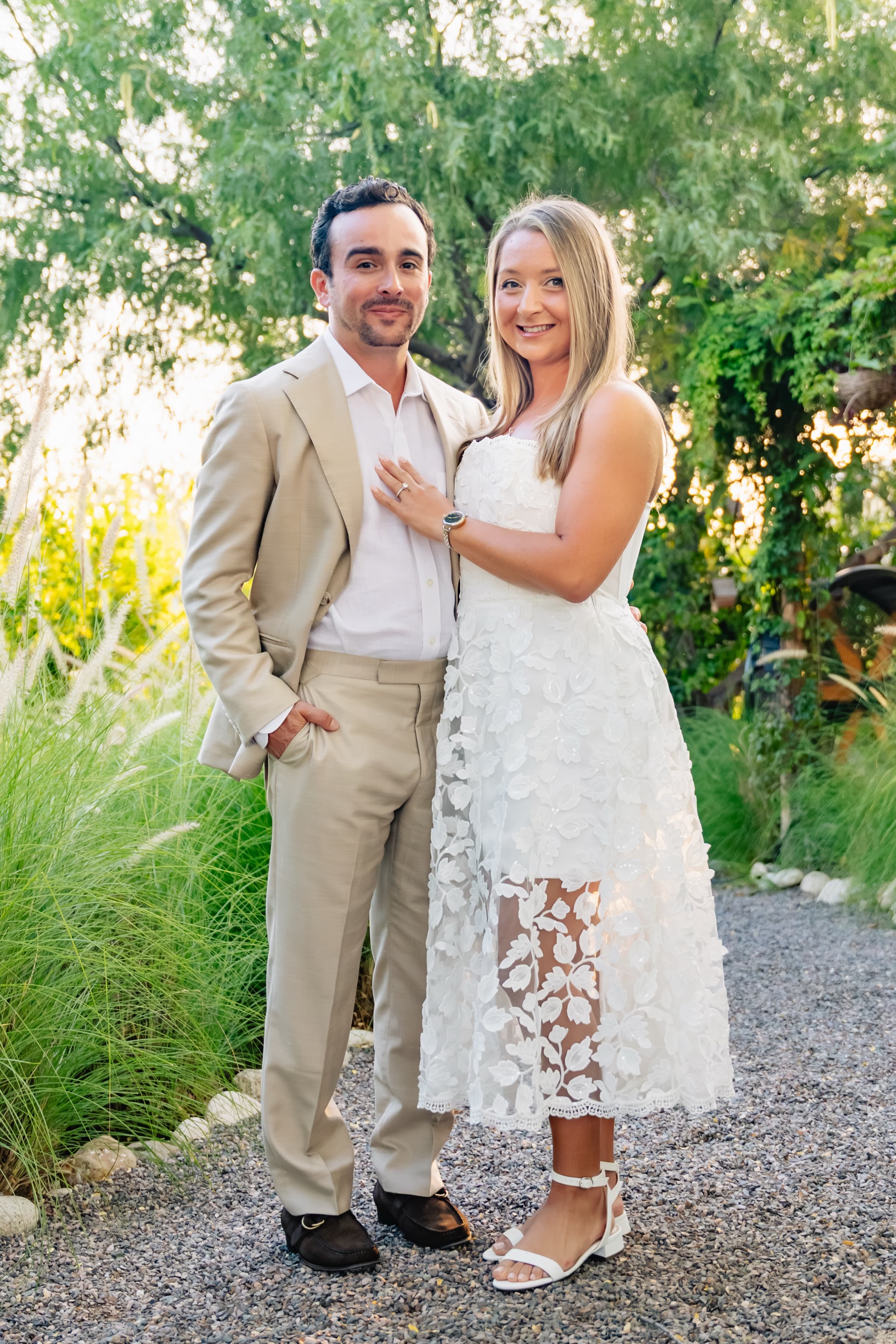 Standing together in a garden with soft golden backlight