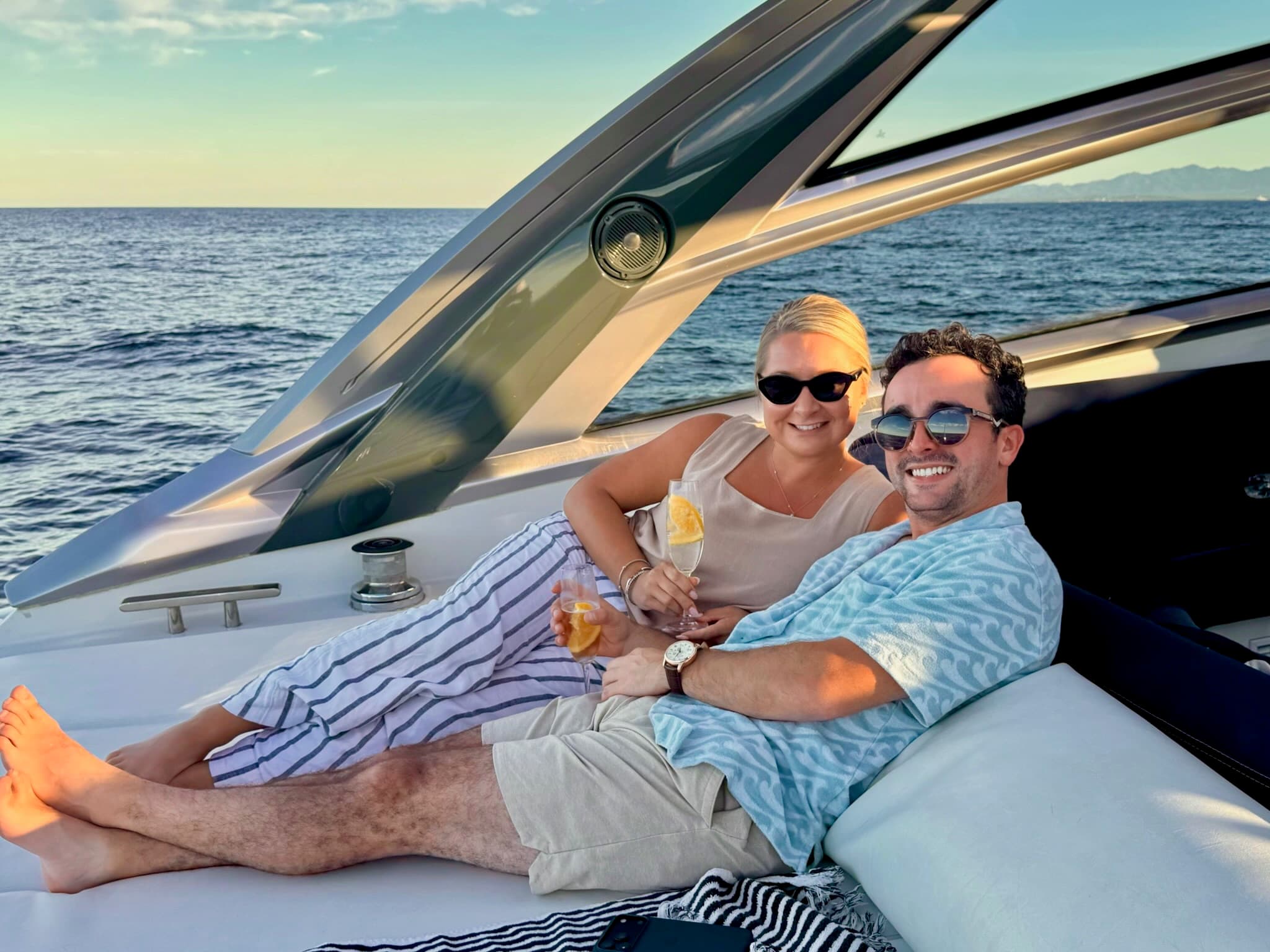 Relaxing together on a yacht at sunset