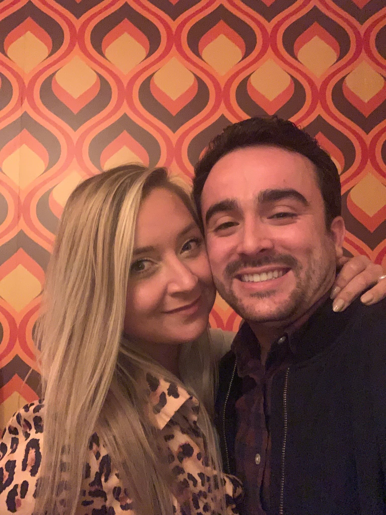 Cozy selfie against a retro patterned wallpaper