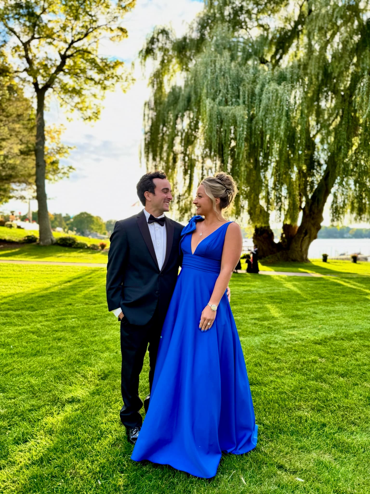 Black-tie elegance under a weeping willow tree