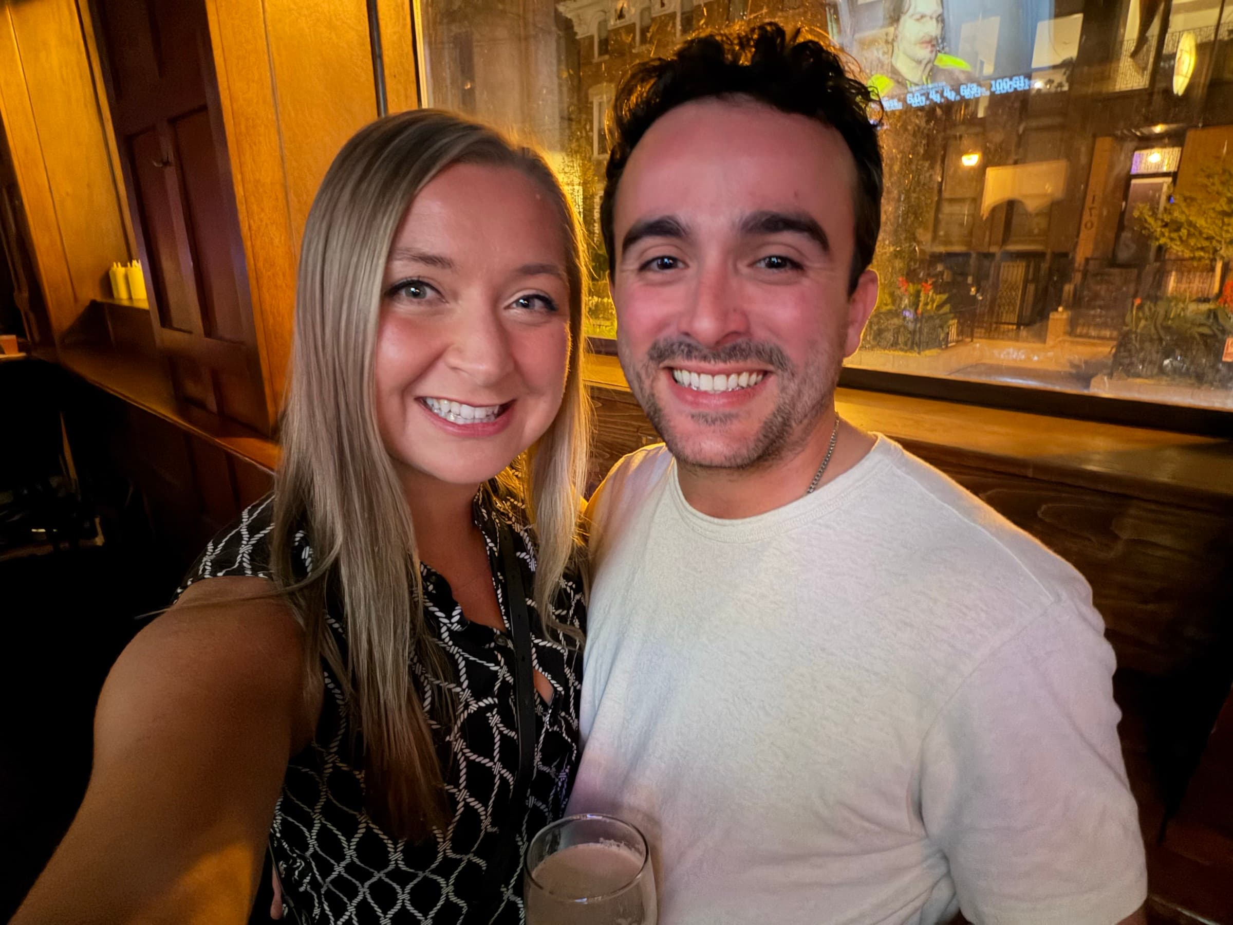 Smiling together at a pub on a cozy night out