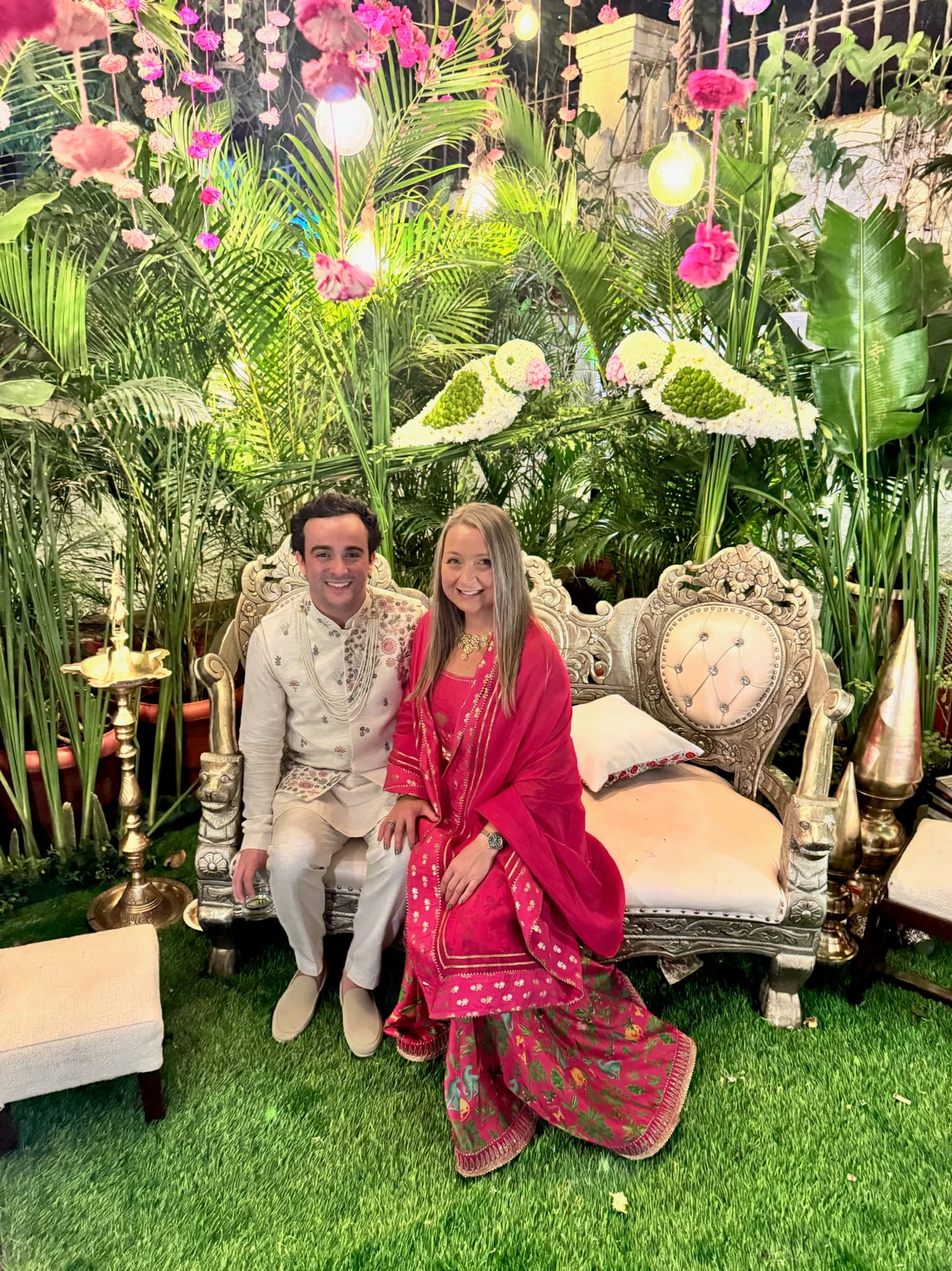 Seated together at a festive tropical celebration