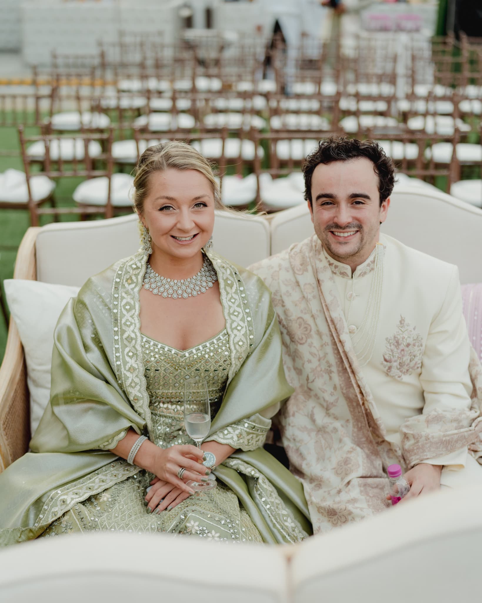 Dressed in traditional Indian wedding attire outdoors